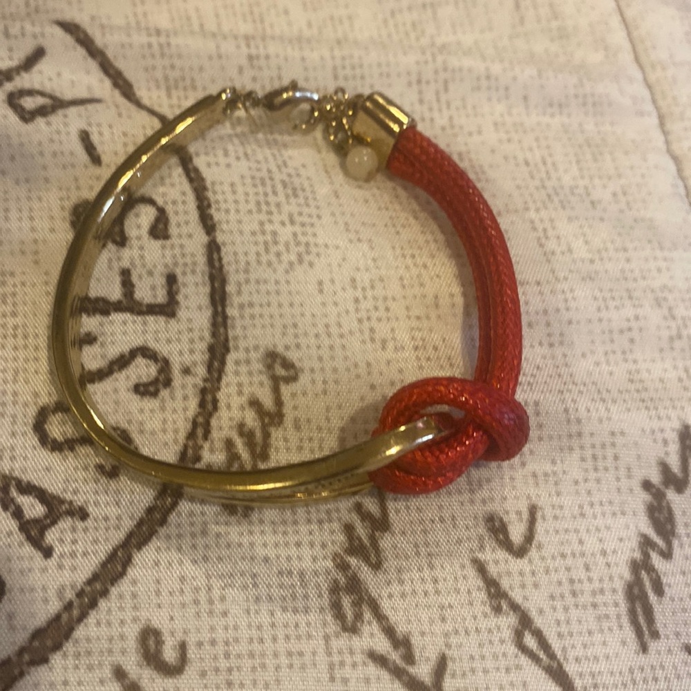 SAQ Red and Goldtone bracelet with words keep going.